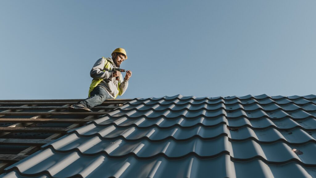 Man on the roof doing installation